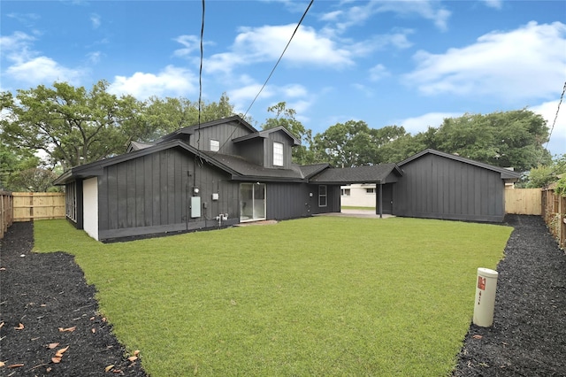 5702 Indigo St, Houston, TX 77096 - back of property featuring a fenced backyard and a shingled roof
