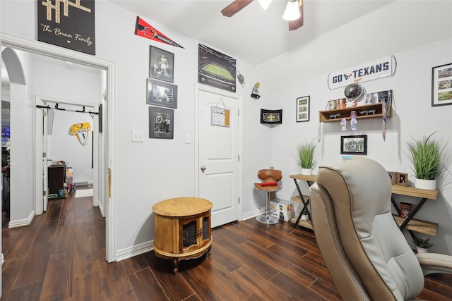 10025 Jason Ct, Beaumont, TX 77705 - office with ceiling fan, wood finished floors, baseboards, lofted ceiling, and arched walkways