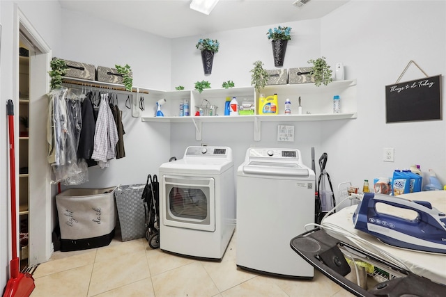 10025 Jason Ct, Beaumont, TX 77705 - laundry room featuring washing machine and dryer and tile patterned flooring