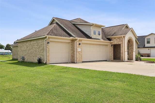 10025 Jason Ct, Beaumont, TX 77705 - view of front of home featuring brick siding, a garage, a front yard, and concrete driveway