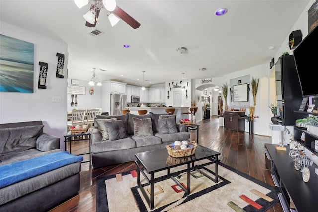 10025 Jason Ct, Beaumont, TX 77705 - living area with ceiling fan, wood-type flooring, and arched walkways