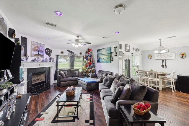10025 Jason Ct, Beaumont, TX 77705 - living room with a tiled fireplace, ceiling fan, and wood finished floors