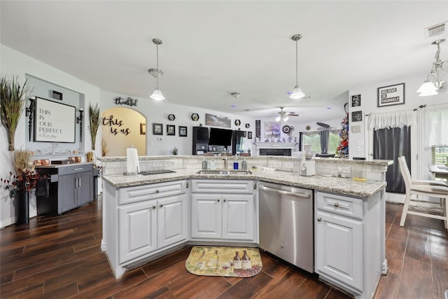 10025 Jason Ct, Beaumont, TX 77705 - kitchen with dishwasher, a sink, a ceiling fan, dark wood-style flooring, and white cabinetry