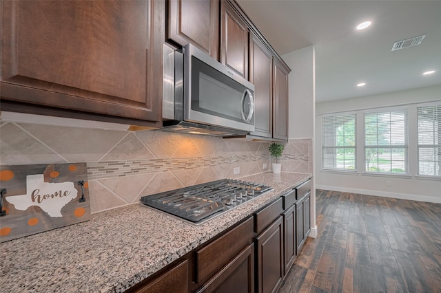 430 Seaside Sparrow Way, Richmond, TX 77469 - kitchen featuring stainless steel appliances, dark wood-style flooring, dark brown cabinetry, backsplash, and recessed lighting