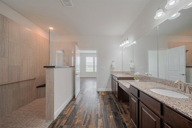 430 Seaside Sparrow Way, Richmond, TX 77469 - full bathroom with walk in shower, wood finished floors, and double vanity