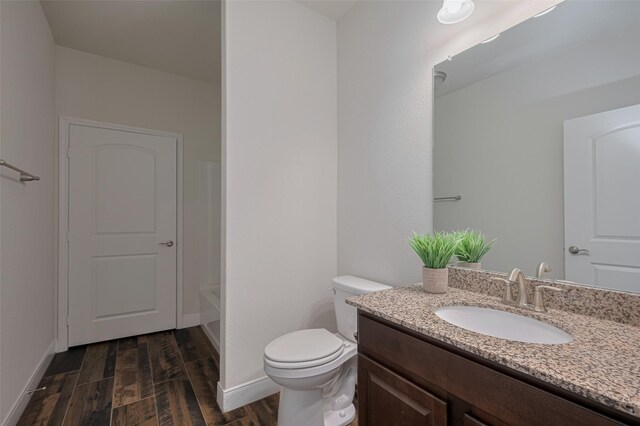 430 Seaside Sparrow Way, Richmond, TX 77469 - bathroom with vanity, wood finished floors, and bathing tub / shower combination