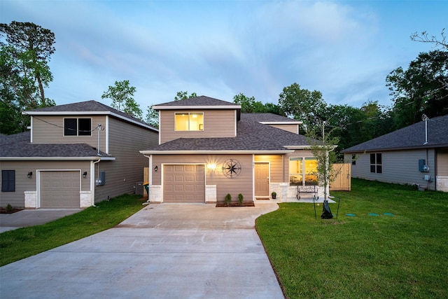 907 Crystal River Rd, Conroe, TX 77316 - traditional-style house with driveway, a front lawn, a shingled roof, and an attached garage