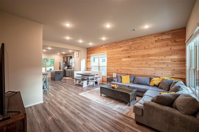 907 Crystal River Rd, Conroe, TX 77316 - living room with recessed lighting, wooden walls, and dark wood finished floors