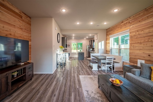 907 Crystal River Rd, Conroe, TX 77316 - living area with wooden walls, dark wood-style floors, and recessed lighting