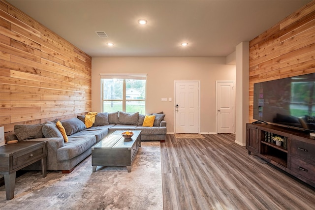907 Crystal River Rd, Conroe, TX 77316 - living area with wood walls, recessed lighting, and wood finished floors