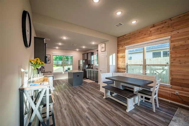 907 Crystal River Rd, Conroe, TX 77316 - dining space featuring wooden walls, recessed lighting, and dark wood-style floors