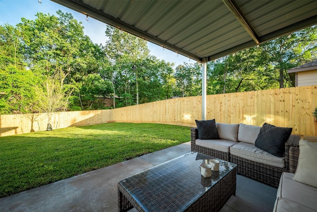 907 Crystal River Rd, Conroe, TX 77316 - fenced backyard featuring a patio area and outdoor lounge area
