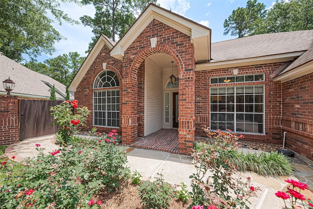 26 Skyland Pl, The Woodlands, TX 77381 - view of front of home featuring brick siding and roof with shingles