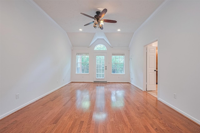 26 Skyland Pl, The Woodlands, TX 77381 - unfurnished room with crown molding, ceiling fan, light wood-type flooring, and lofted ceiling