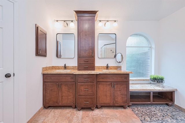 26 Skyland Pl, The Woodlands, TX 77381 - bathroom featuring double vanity and a shower