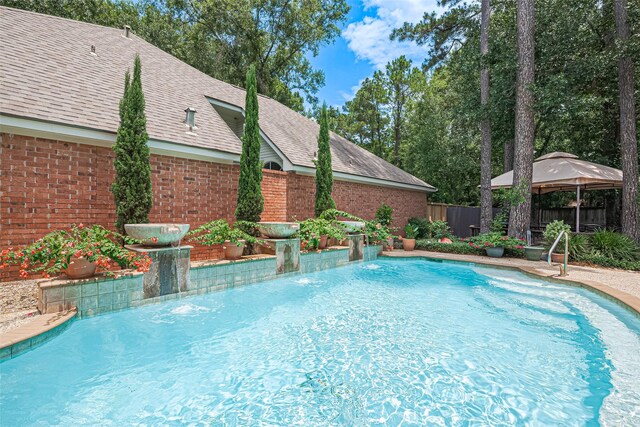 26 Skyland Pl, The Woodlands, TX 77381 - view of swimming pool featuring a gazebo and a fenced backyard