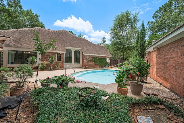 26 Skyland Pl, The Woodlands, TX 77381 - view of swimming pool with a patio and a fenced backyard