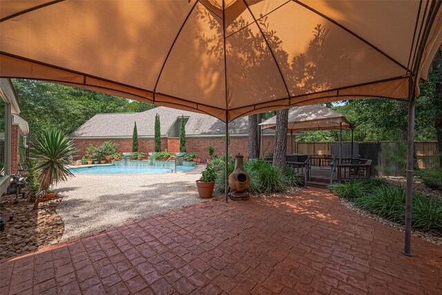 26 Skyland Pl, The Woodlands, TX 77381 - view of patio / terrace with a gazebo and a deck