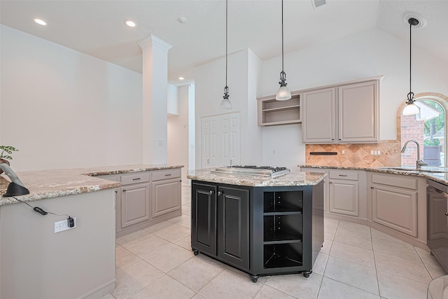26 Skyland Pl, The Woodlands, TX 77381 - kitchen with open shelves, appliances with stainless steel finishes, a kitchen island, decorative backsplash, and light tile patterned flooring