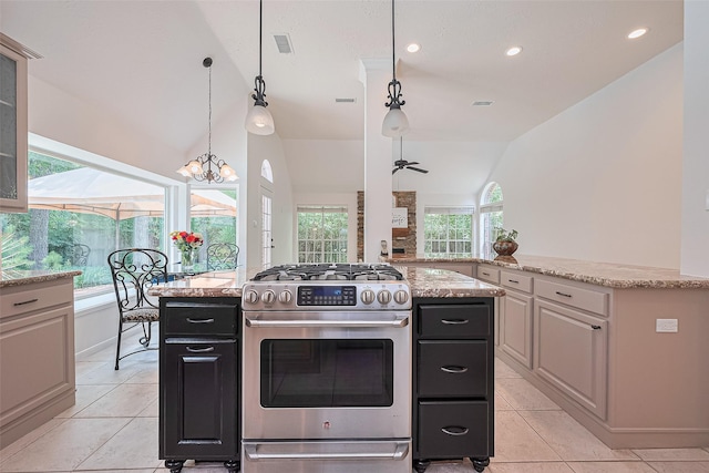 26 Skyland Pl, The Woodlands, TX 77381 - kitchen with stainless steel gas range, lofted ceiling, light tile patterned flooring, a kitchen island, and glass insert cabinets