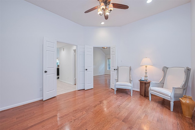 26 Skyland Pl, The Woodlands, TX 77381 - living area with ceiling fan, light wood-type flooring, and recessed lighting