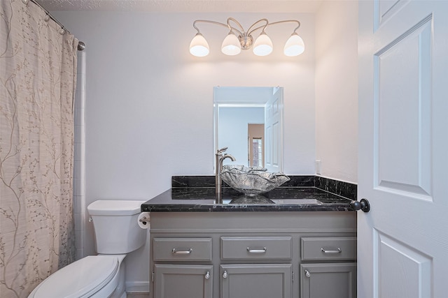 26 Skyland Pl, The Woodlands, TX 77381 - bathroom featuring vanity and toilet