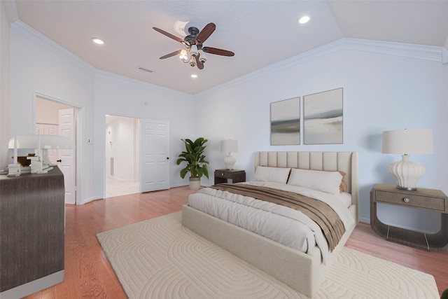 26 Skyland Pl, The Woodlands, TX 77381 - bedroom with light wood-style flooring, crown molding, recessed lighting, ceiling fan, and lofted ceiling