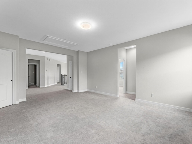 2107 Jitterbug Ln, Katy, TX 77493 - spare room featuring attic access, light colored carpet, and baseboards