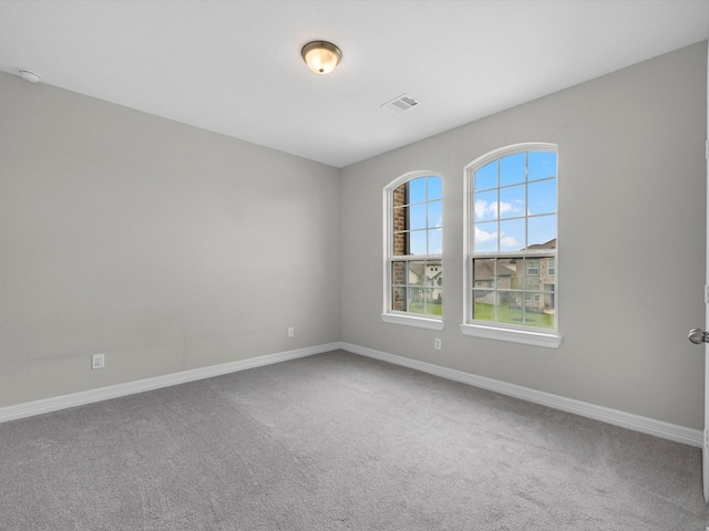 2107 Jitterbug Ln, Katy, TX 77493 - carpeted spare room with baseboards and a smoke detector