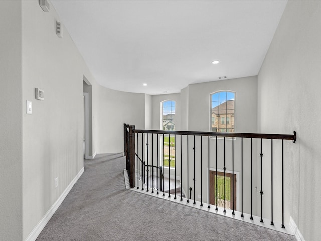 2107 Jitterbug Ln, Katy, TX 77493 - hallway with carpet floors, baseboards, recessed lighting, and an upstairs landing