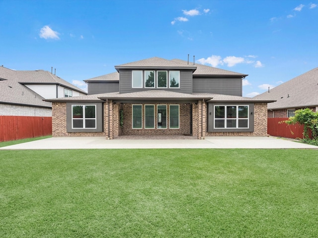 2107 Jitterbug Ln, Katy, TX 77493 - rear view of property with a patio, brick siding, and roof with shingles