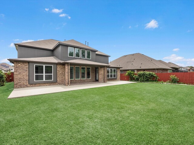 2107 Jitterbug Ln, Katy, TX 77493 - back of house featuring a patio area, brick siding, and roof with shingles