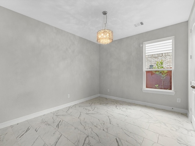 2107 Jitterbug Ln, Katy, TX 77493 - unfurnished room with light marble finish floors, a chandelier, and baseboards