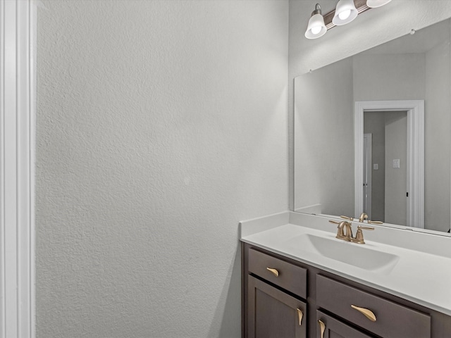 2107 Jitterbug Ln, Katy, TX 77493 - bathroom featuring vanity and a textured wall