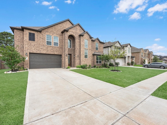 2107 Jitterbug Ln, Katy, TX 77493 - view of front of property featuring brick siding, a front lawn, a garage, concrete driveway, and a residential view