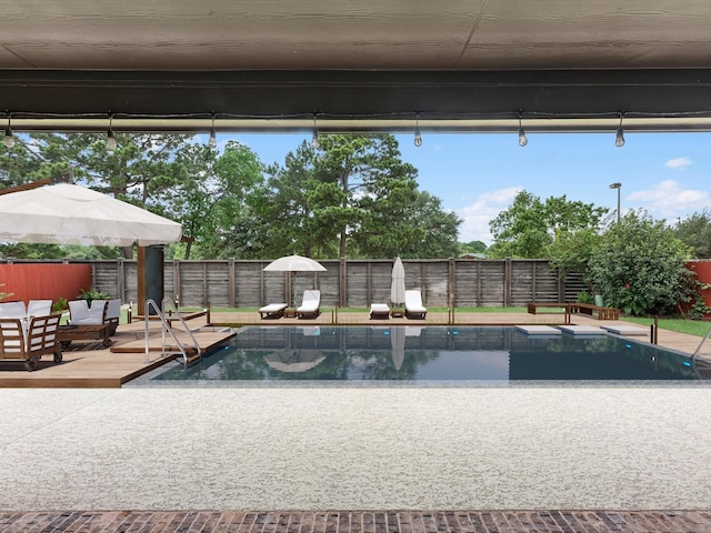 2107 Jitterbug Ln, Katy, TX 77493 - view of pool featuring a fenced backyard and a patio area
