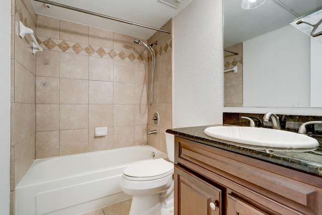 4515 Briar Hollow Pl Unit 213, Houston, TX 77027 - full bath with toilet, vanity, bathtub / shower combination, tile patterned floors, and a textured wall
