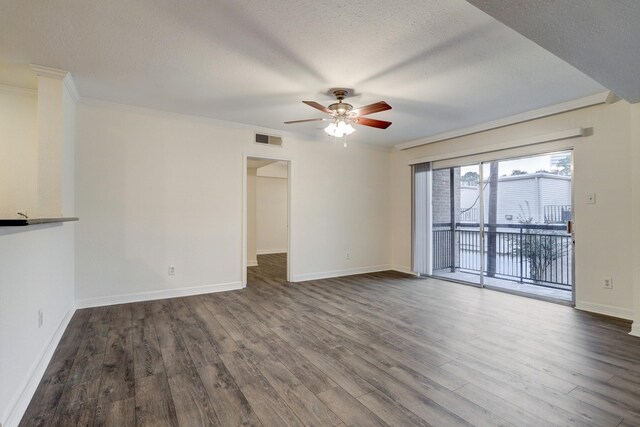 4515 Briar Hollow Pl Unit 213, Houston, TX 77027 - unfurnished living room with ceiling fan, dark wood-style flooring, ornamental molding, baseboards, and a textured ceiling