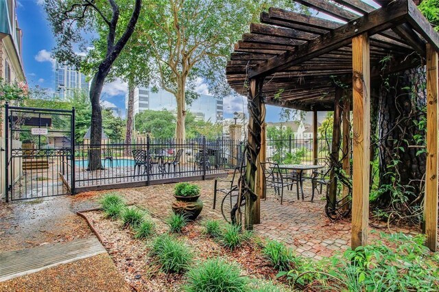 4515 Briar Hollow Pl Unit 213, Houston, TX 77027 - fenced backyard with a pergola, a patio, a community pool, and outdoor dining space