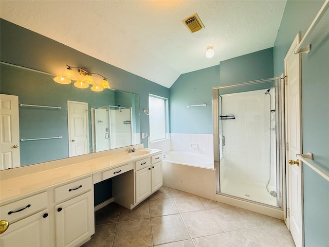 210 Cedar Lake Dr, League City, TX 77573 - full bath featuring a garden tub, a stall shower, vaulted ceiling, vanity, and tile patterned floors