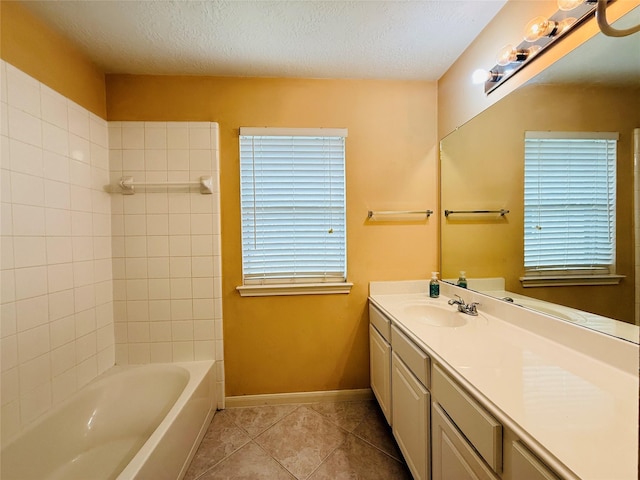 210 Cedar Lake Dr, League City, TX 77573 - full bathroom with vanity, tile patterned flooring, a textured ceiling, and  shower combination