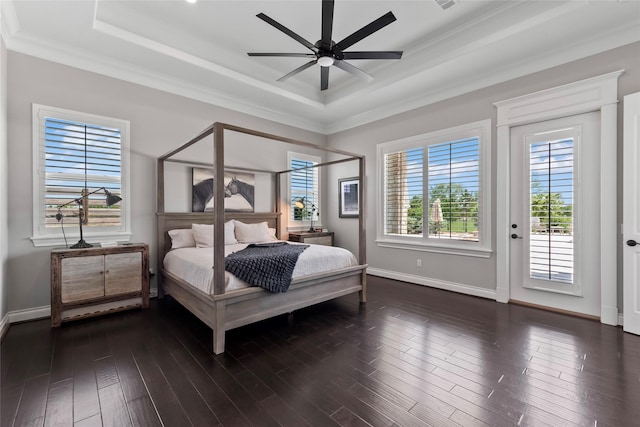 2112 Washington Ave, Alvin, TX 77511 - bedroom featuring a raised ceiling, access to exterior, crown molding, baseboards, and dark wood finished floors