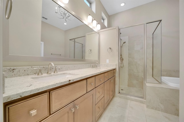 5401 Larkin St, Houston, TX 77007 - bathroom with double vanity, a shower stall, a garden tub, and tile patterned floors