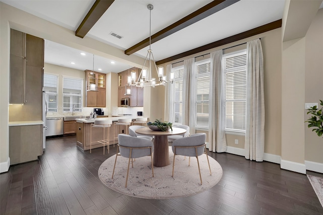 5401 Larkin St, Houston, TX 77007 - dining room featuring a chandelier, beam ceiling, dark wood finished floors, recessed lighting, and baseboards