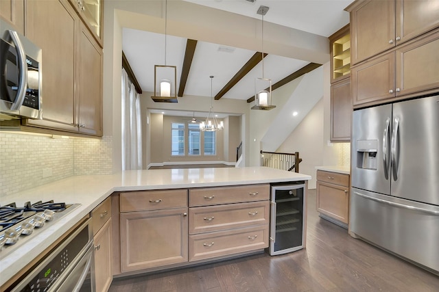 5401 Larkin St, Houston, TX 77007 - kitchen with appliances with stainless steel finishes, beverage cooler, a peninsula, dark wood-style floors, and decorative backsplash