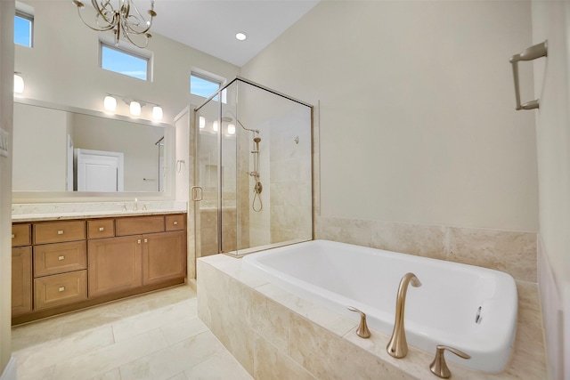5401 Larkin St, Houston, TX 77007 - bathroom featuring vanity, a garden tub, a stall shower, a chandelier, and tile patterned floors