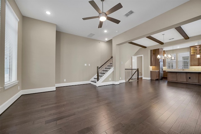 5401 Larkin St, Houston, TX 77007 - unfurnished living room with a chandelier, dark wood-type flooring, a ceiling fan, a sink, and beam ceiling