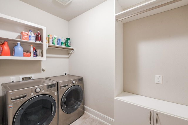 13326 Hartford Bay Trl, Cypress, TX 77429 - washroom with washing machine and dryer and light tile patterned flooring
