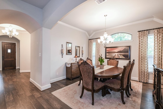13326 Hartford Bay Trl, Cypress, TX 77429 - dining area with a chandelier, arched walkways, dark wood finished floors, and crown molding