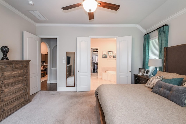 13326 Hartford Bay Trl, Cypress, TX 77429 - carpeted bedroom featuring crown molding, arched walkways, connected bathroom, ceiling fan, and lofted ceiling